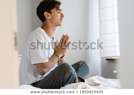 Stok fotoğraf: Handsome Men Praying In Bedroom