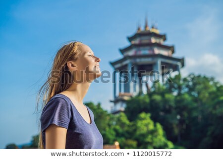 Stok fotoğraf: Young Woman Tourist In Buddhist Temple Kek Lok Si In Penang Malaysia Georgetown