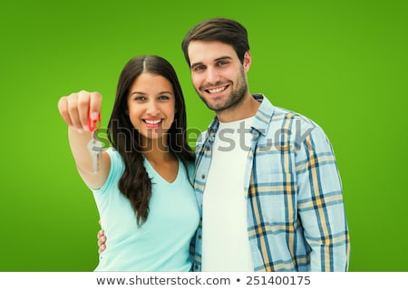 Zdjęcia stock: Couple Holding Key In Front Of Vignette