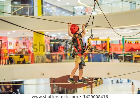 Сток-фото: Adorable Little Boy Enjoying His Time In Climbing Adventure Park In The Mall Banner Long Format