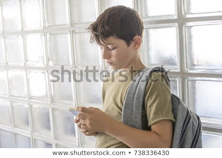 Student Boy With School Bag Calling On Smartphone Stockfoto © 2Design