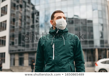 ストックフォト: A Man In The City With Medical Mask