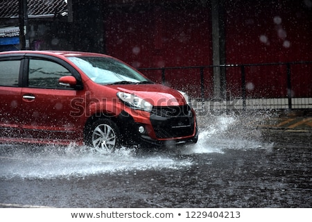 Stockfoto: Truck Passes Through A Puddle