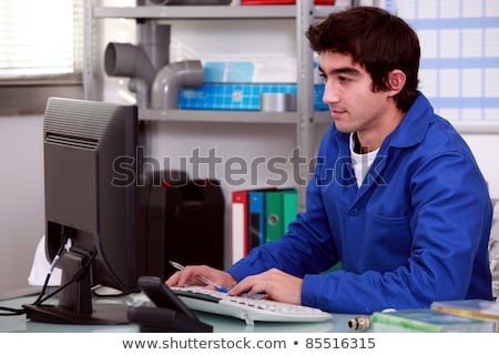 Stock fotó: Plumber Using Desktop Computer