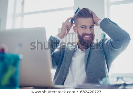 ストックフォト: Young Fashion Man Fixing His Hair