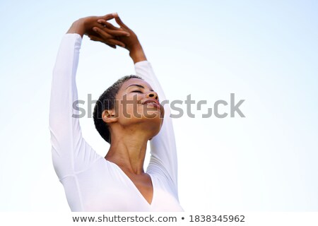 [[stock_photo]]: Female Student In Shorts Stretches One Arm