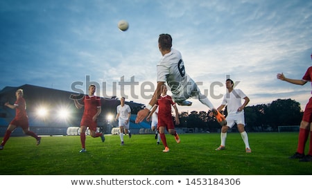 Stock foto: Footballer Doing Scissors Kick