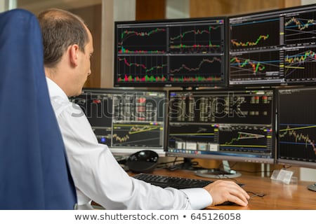 Foto stock: Stock Exchange Trader Analyzing Graphs Chart Or Data On Multiple