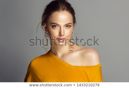 Foto stock: Makeup Products Young Beautiful Girl With Gold Earrings And Ring Smiling On White Background Red N