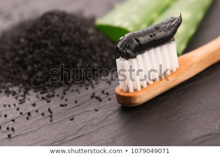 Foto d'archivio: Toothbrush With Black Charcoal Toothpaste