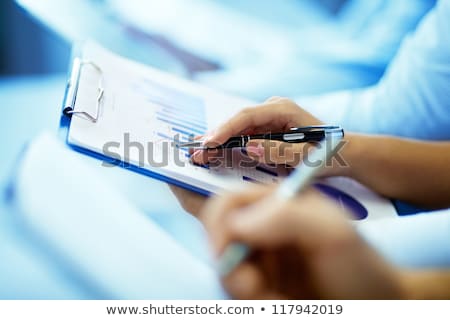 Stock photo: Businesswoman Writing On Graph