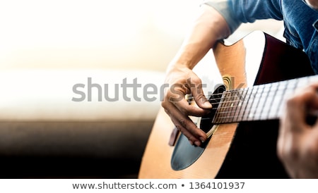 Foto stock: Hand Playing Acoustic Guitar