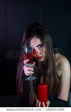 Zdjęcia stock: Beautiful Vampire Woman In Red Dress Drinking