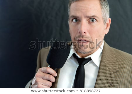 Stok fotoğraf: Depressed Man Speaks Into Microphone