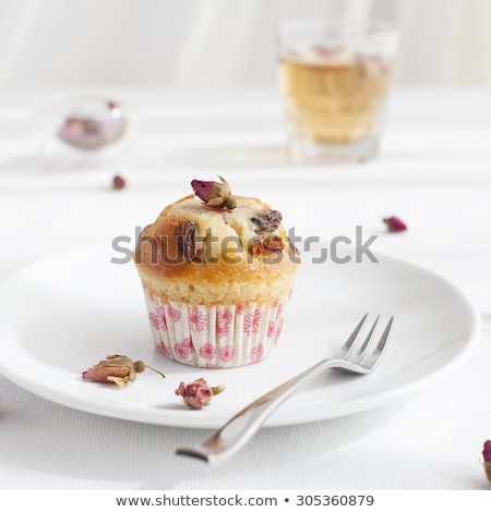 Zdjęcia stock: Muffin Mini Cake Cup Cake On A White Plate With A Rose Buds Tea On A White Textile Background