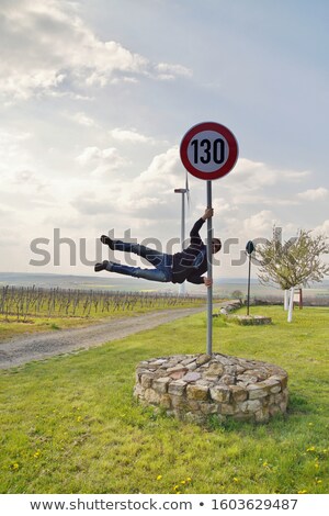 Foto d'archivio: 130 Kmph Or Mph Driving Speed Limit Sign On Highway