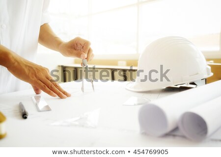 Stock foto: Architects With Blueprint And Helmets At Office