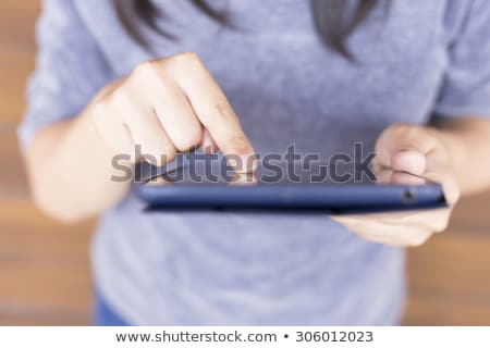 Foto d'archivio: Close Up Of Female Gardener With Tablet Pc
