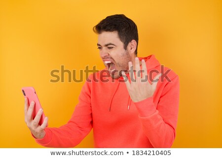 Foto stock: Casual Man Having A Phone Argument And Gesturing