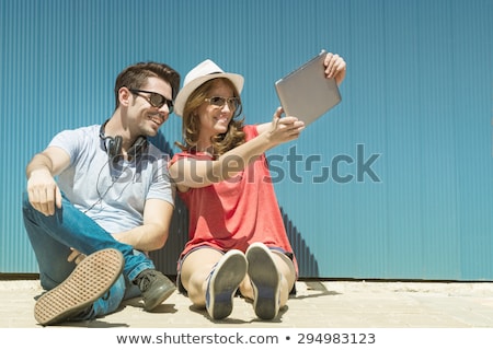 [[stock_photo]]: Women With City Guide And Map Taking Selfie