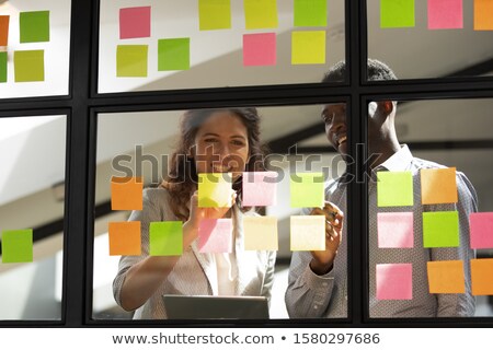 Foto stock: Business Team Two Colleagues Discussing Working With Many Docume