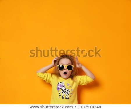 Stock fotó: Amazed Teenage Girl In Yellow Sunglasses