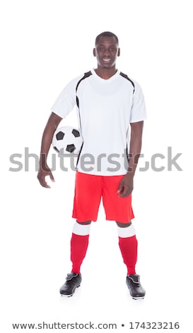 Foto d'archivio: Happy Muscular Young Man Holding Soccer Ball Over White