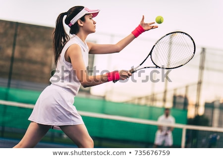 ストックフォト: Young Girl Playing Tennis On Court