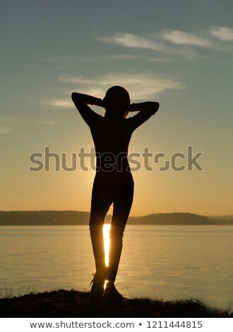 Stockfoto: Happy Woman Lifting One Leg In The Air