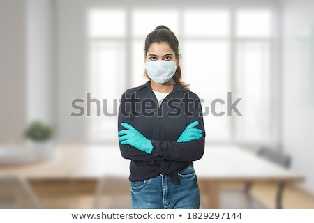 Foto stock: Portrait Of Standing Woman Wearing Latex Clothes