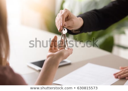Foto stock: Agent Getting Keys To Customer New House Hand Of Real Estate Ag