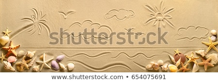 Drawing In Sand Foto stock © Smileus