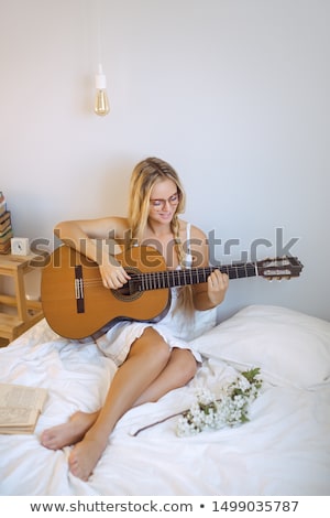 Foto stock: Blonde Woman Portrait With Guitar