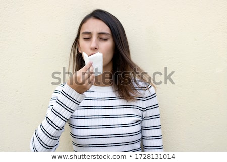 Foto stock: Pretty Woman Mouth Blowing Cold Breeze