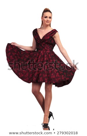 Foto stock: Woman In Casual Dress Playing Hith Her Hair
