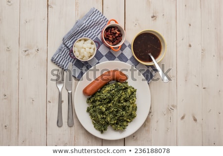 Foto d'archivio: Boerenkool With Smoked Sausage On A White Plate