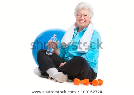 Сток-фото: Senior Woman Rests And Drinks Water After Workout