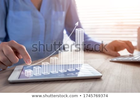 Stock fotó: Young Businesswoman In Business Concept With Bar Charts