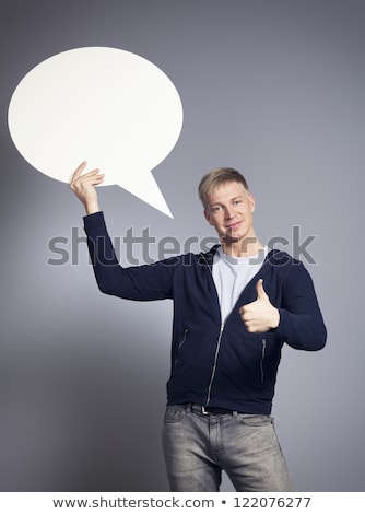 Stock photo: Joyful Man Giving Thumbs Up At Blank Signboard