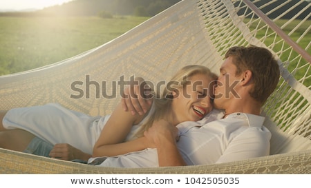 Stock photo: Laughing Happy Woman Reclining In A Hammock