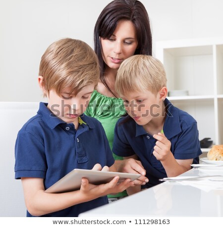 Stock photo: Mother With Two Sons And Tablet Computer