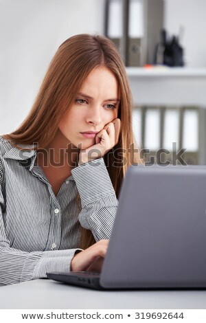 Brunette Businesswoman Bored At Work Foto stock © luckyraccoon