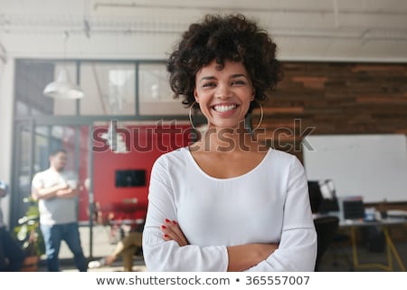 Foto stock: Portrait Of A Beautiful Businesswoman In Front Of Colleagues