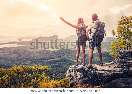 Stok fotoğraf: Traveller With Backpack Standing On The Rocks