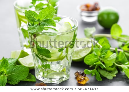 Foto stock: Mojito Cubano Or Caipirinha Cocktail Iced Drink With Lime And Mint