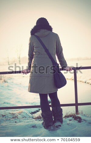 Stock fotó: Woman Standing On Rail Watching Sunset