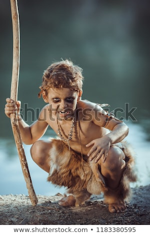 Zdjęcia stock: Angry Caveman Manly Boy With Staff Hunting Outdoors Ancient Warrior