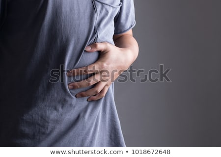 Stock fotó: Man In Pain Holding His Stomach