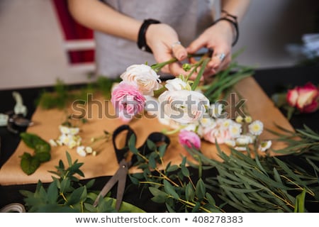 Stock foto: Young Woman Creating Beautiful Floral Arrangement