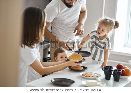 ストックフォト: Little Girl Eating Pancakes With Her Father